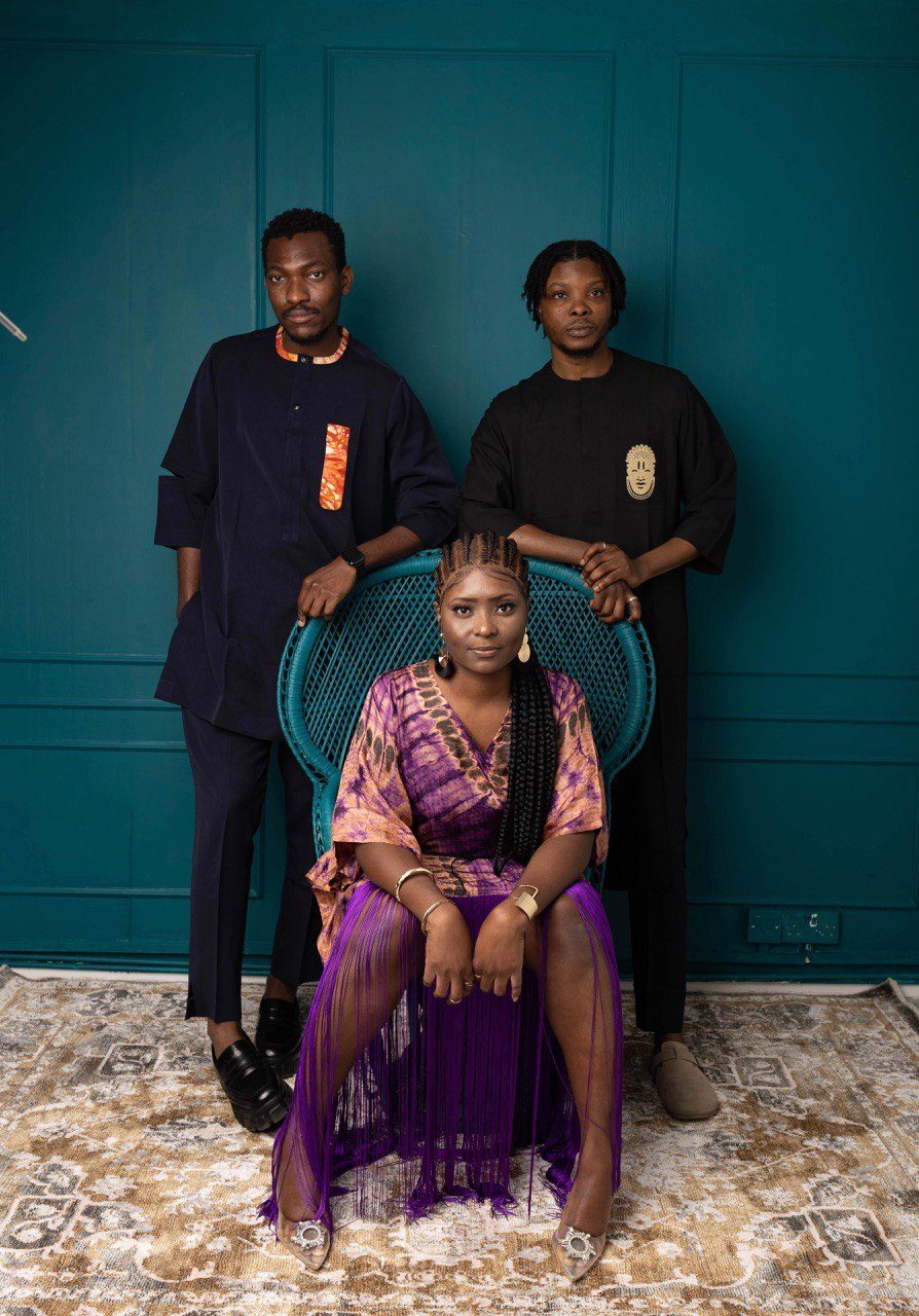 Women's fashion piece from the "Sankofa Reflections" collection featuring a purple and gold tie-dye kaftan with dramatic fringes.