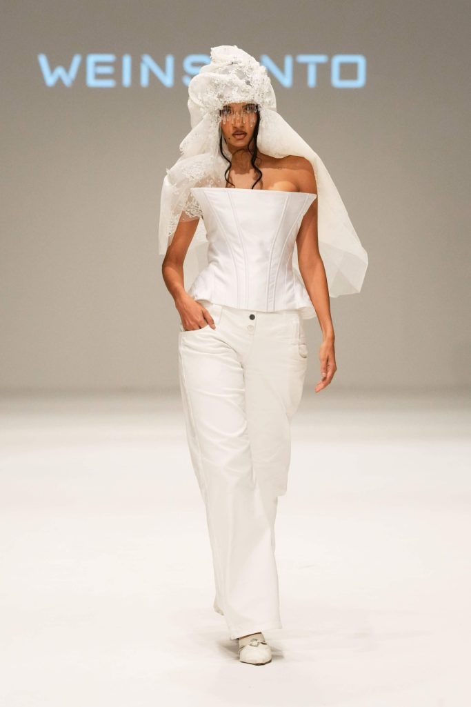 Weinsanto's collection at Dubai Fashion Week SS24, featuring diverse silhouettes and artistic eveningwear.